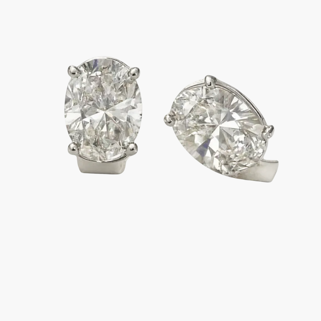Pair of diamond earrings on a white background