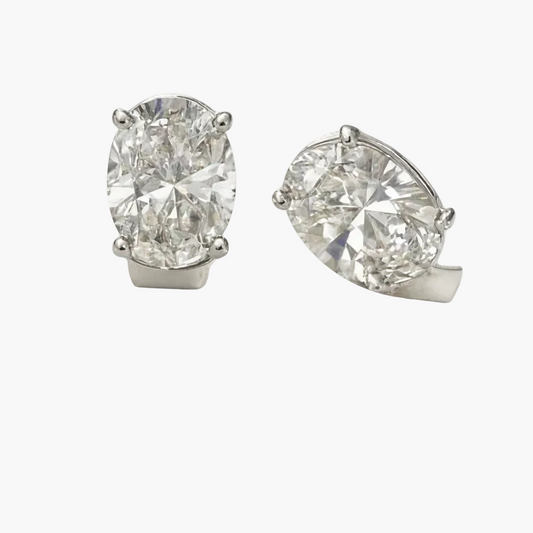 Pair of diamond earrings on a white background