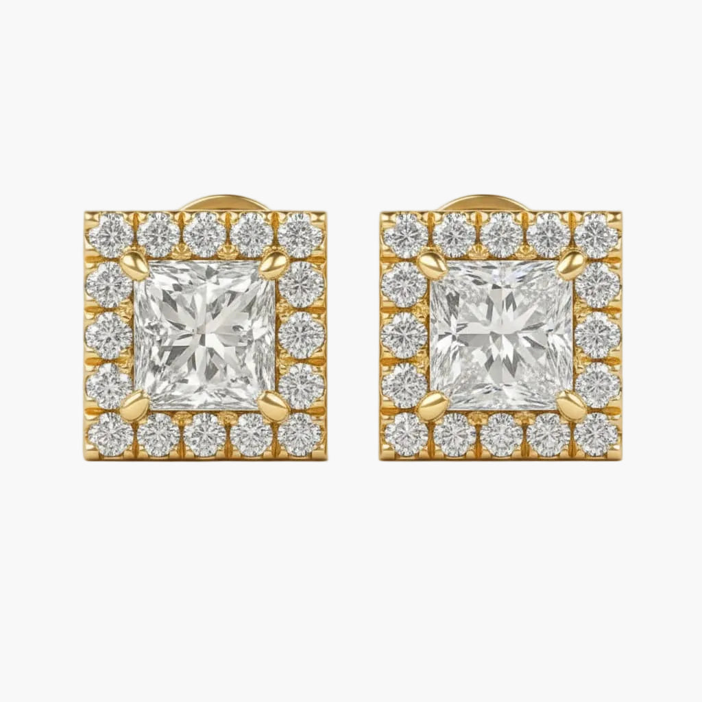 Pair of diamond earrings with gold accents on a white background
