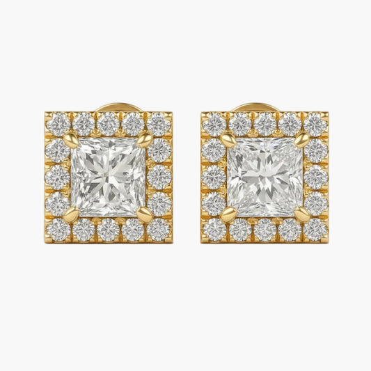 Pair of diamond earrings with gold accents on a white background