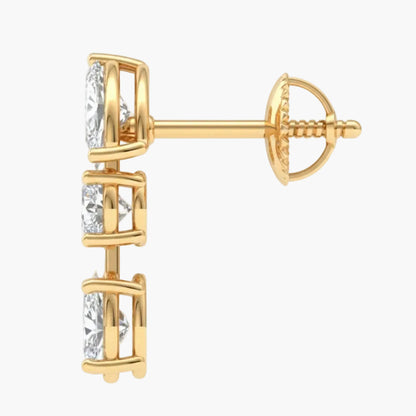 Gold earring with clear gemstones on a white background