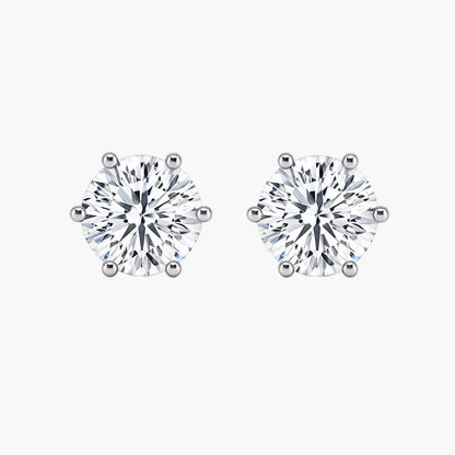 Pair of diamond stud earrings on a white background
