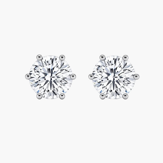 Pair of diamond stud earrings on a white background