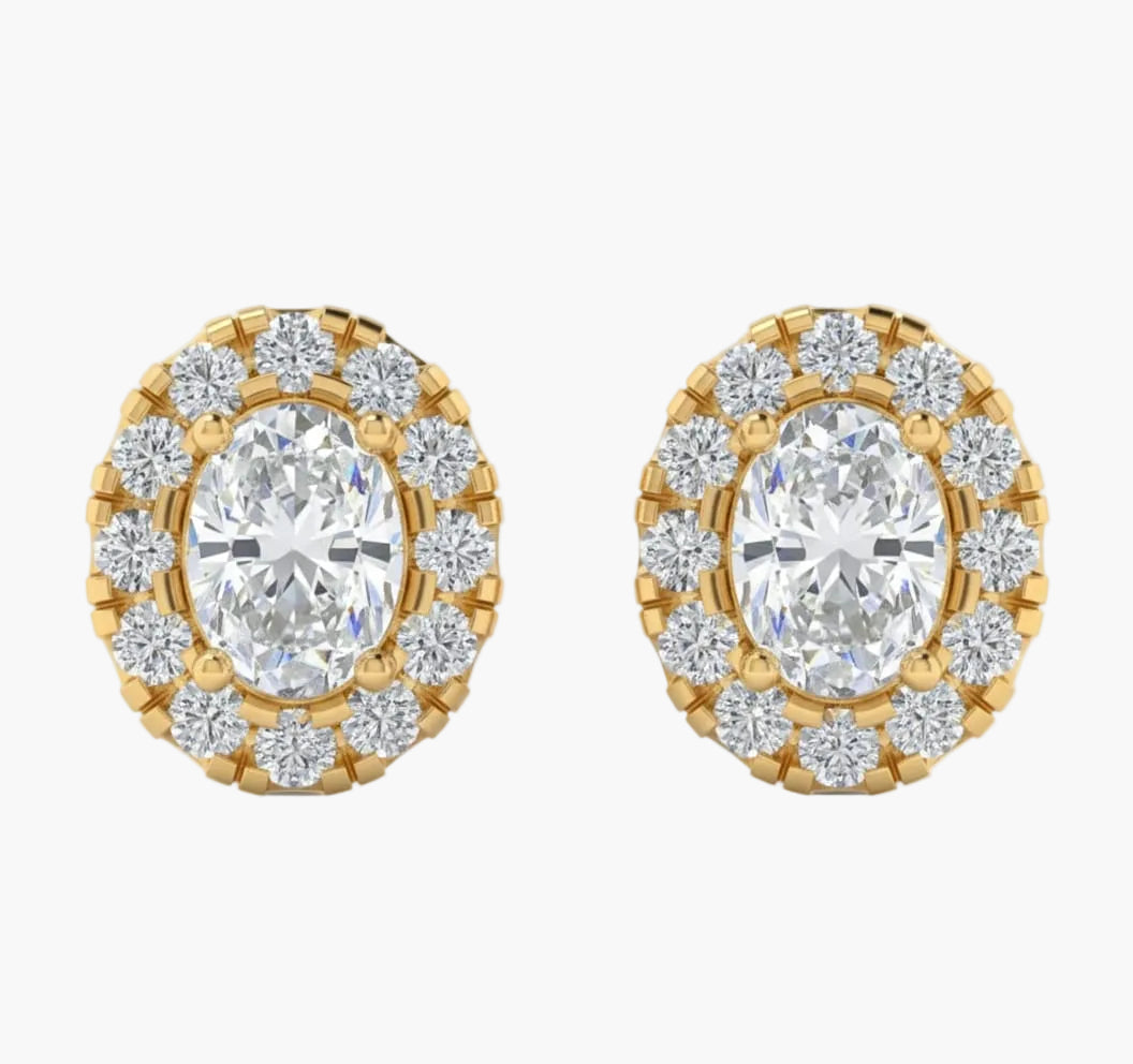Gold and diamond earrings on a white background