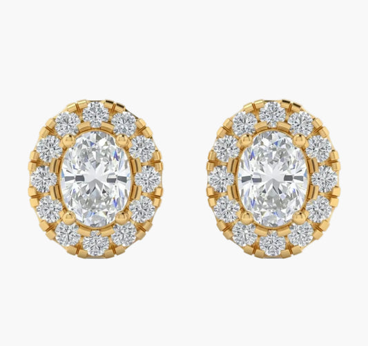 Gold and diamond earrings on a white background