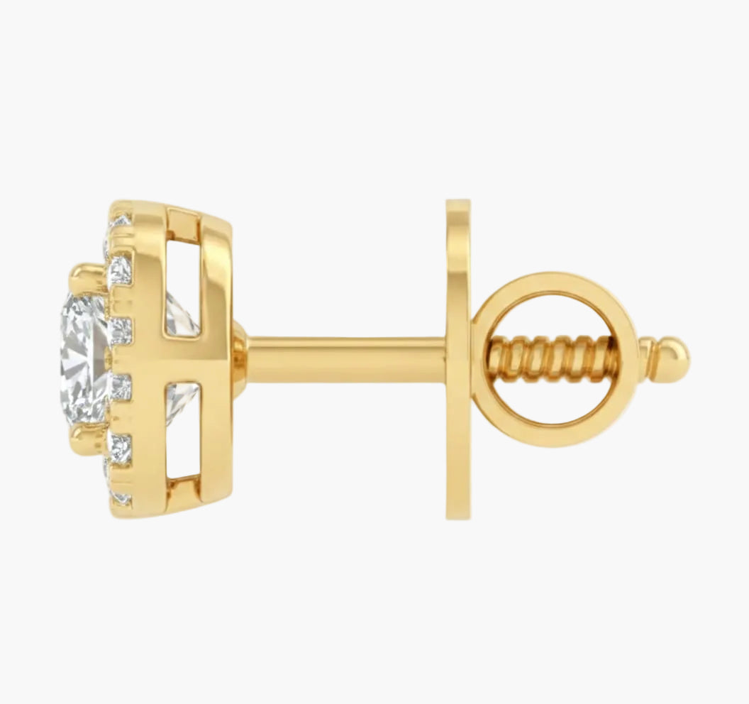 Gold earring with a clear gemstone on a white background