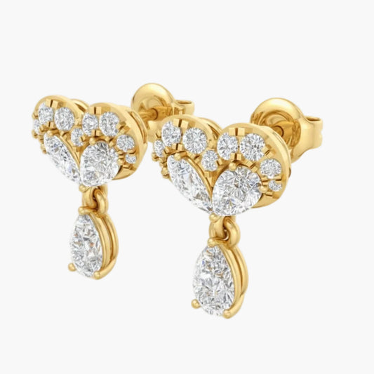 Gold earrings with diamond accents on a white background