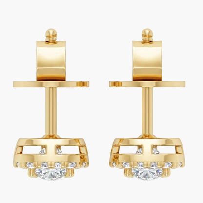 Gold earrings with clear gemstones on a white background