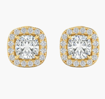 Gold earrings with diamond-like stones on a white background