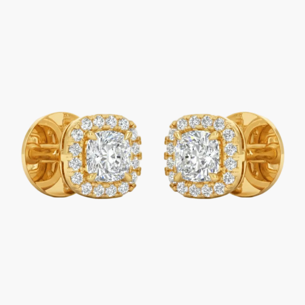 Gold earrings with diamond accents on a light gray background
