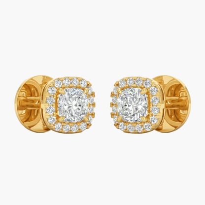 Gold earrings with diamond accents on a light gray background