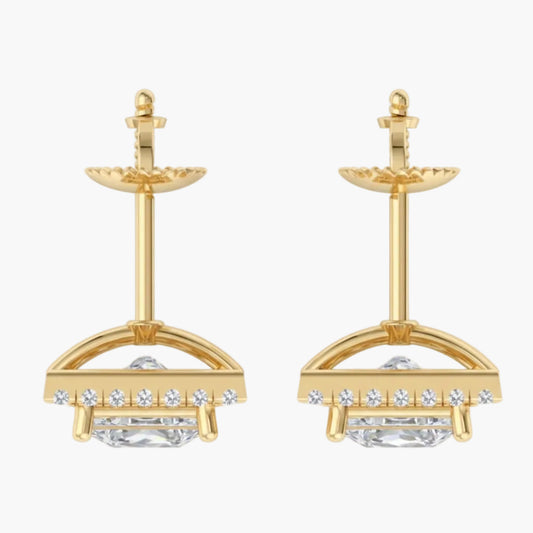 Gold earrings with clear gemstones on a white background