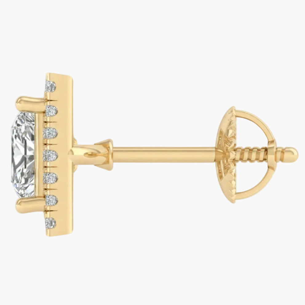 Gold earring with a clear gemstone on a white background