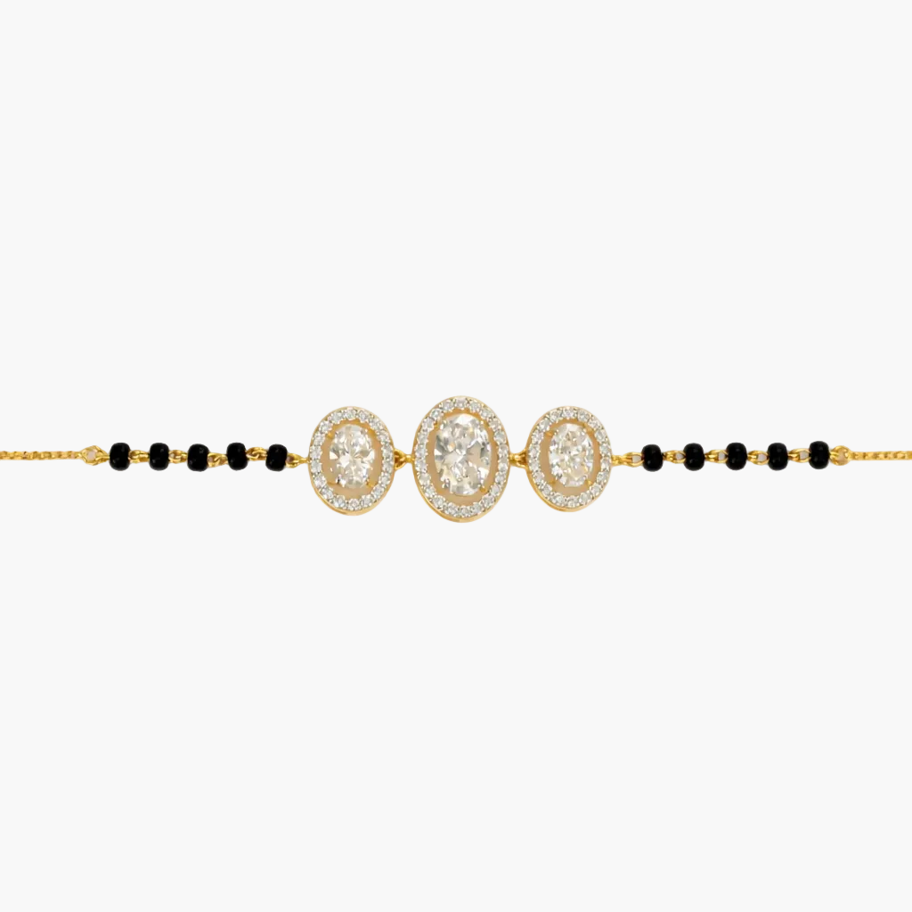 Gold and black beaded necklace on a white background