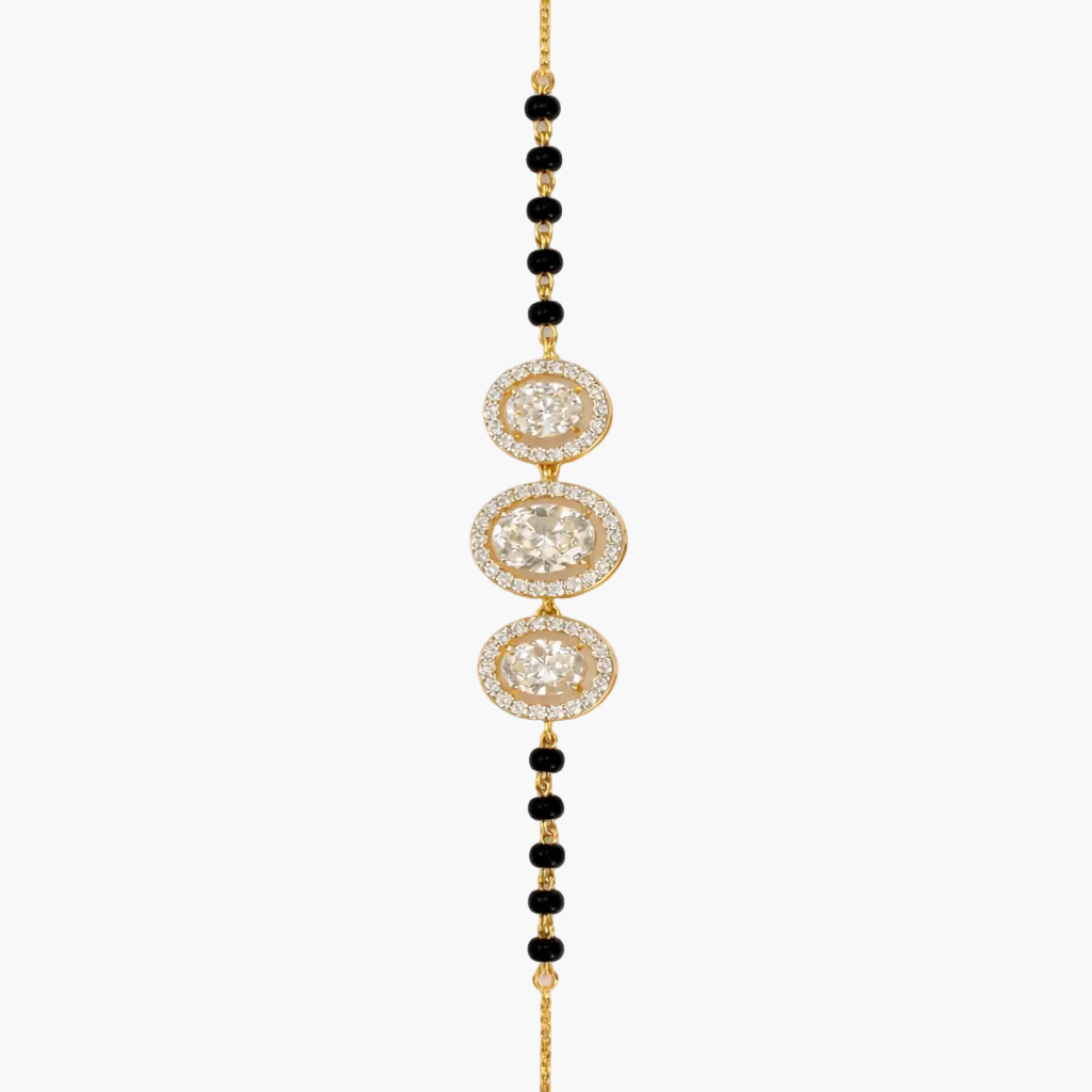 Gold and black beaded necklace on a white background