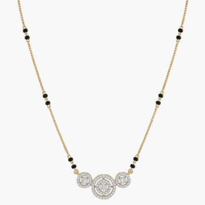 Necklace with gold chain, black beads, and diamond pendants on a white background