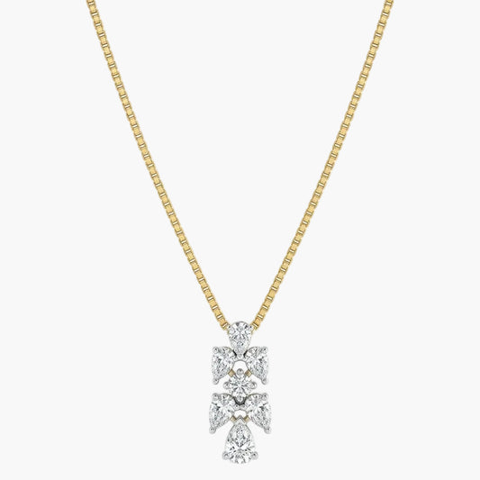 Gold necklace with a diamond pendant on a white background