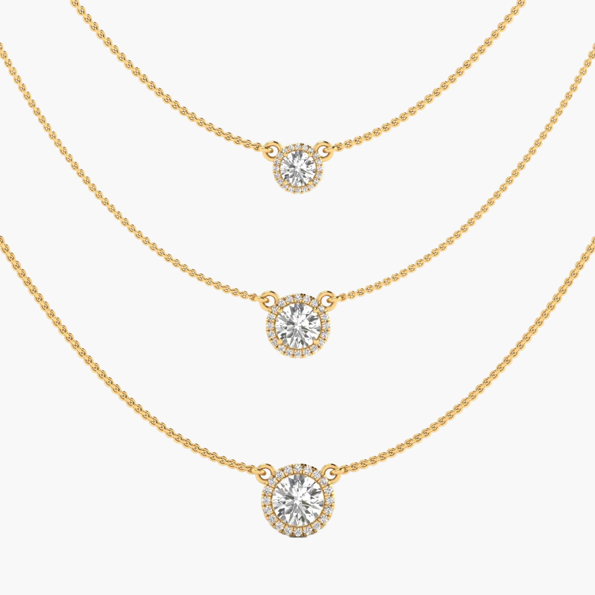 Three gold necklaces with round diamond pendants on a white background