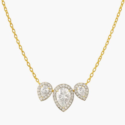 Gold necklace with three heart-shaped diamond pendants on a white background