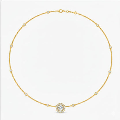 Gold necklace with a central round pendant on a white background