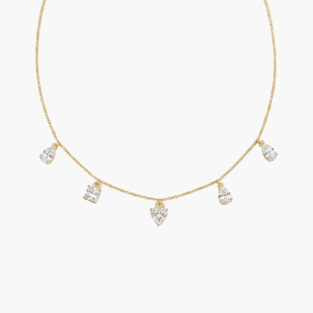 Gold necklace with teardrop-shaped diamonds on a white background