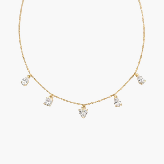 Gold necklace with teardrop-shaped diamonds on a white background