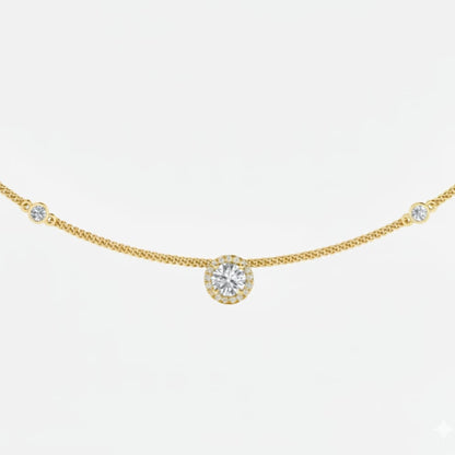 Gold necklace with a round diamond pendant on a white background