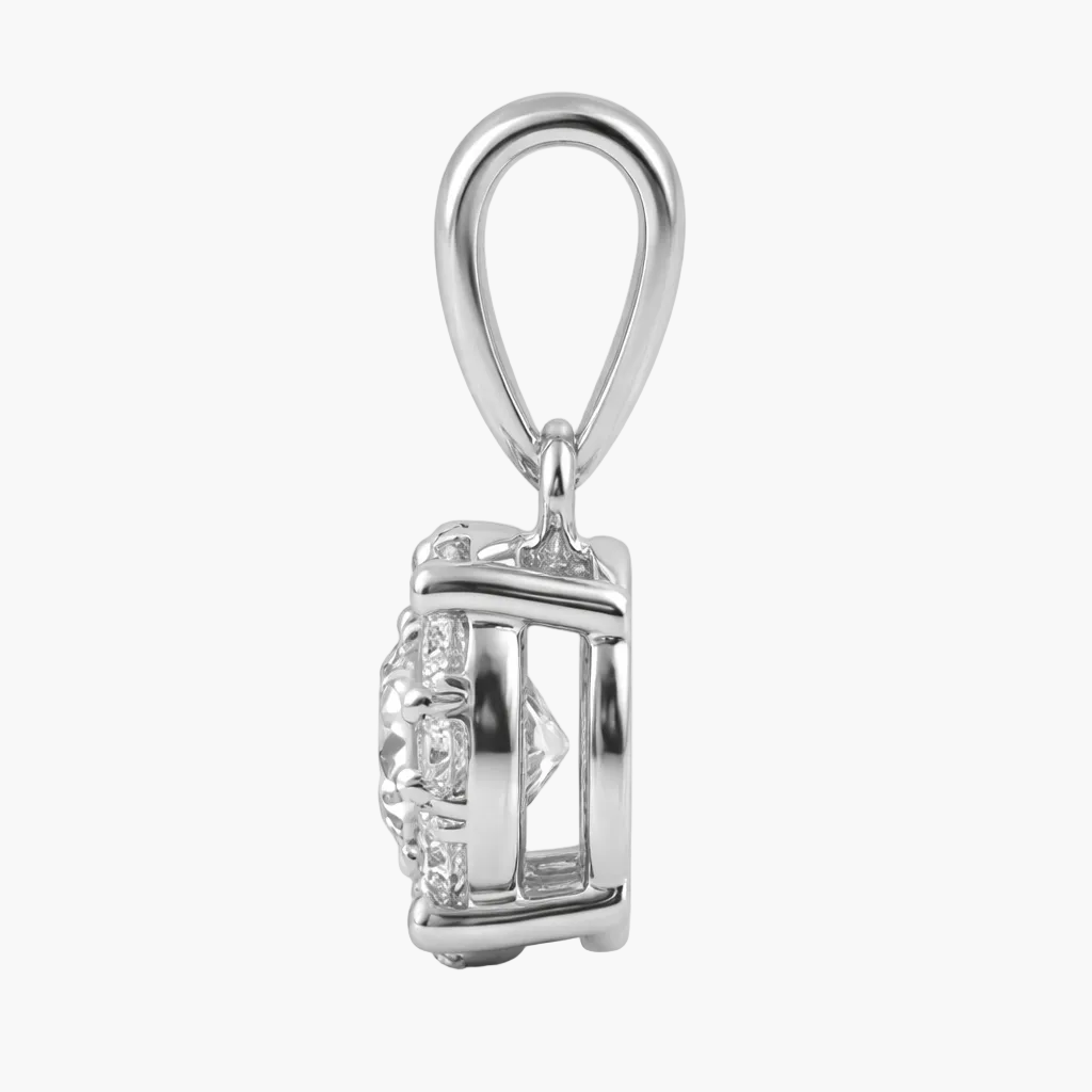 Silver pendant with a clear gemstone on a white background