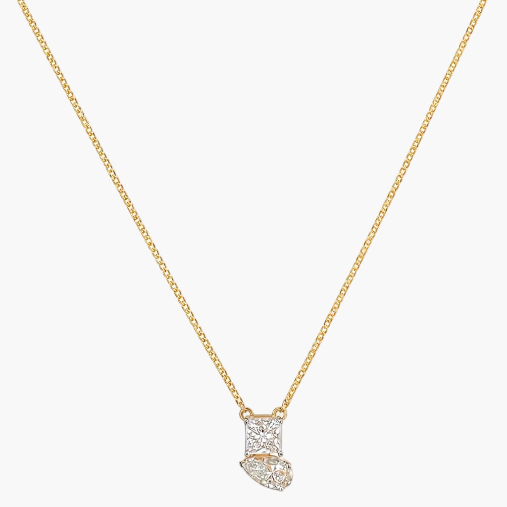 Gold necklace with a diamond pendant on a white background