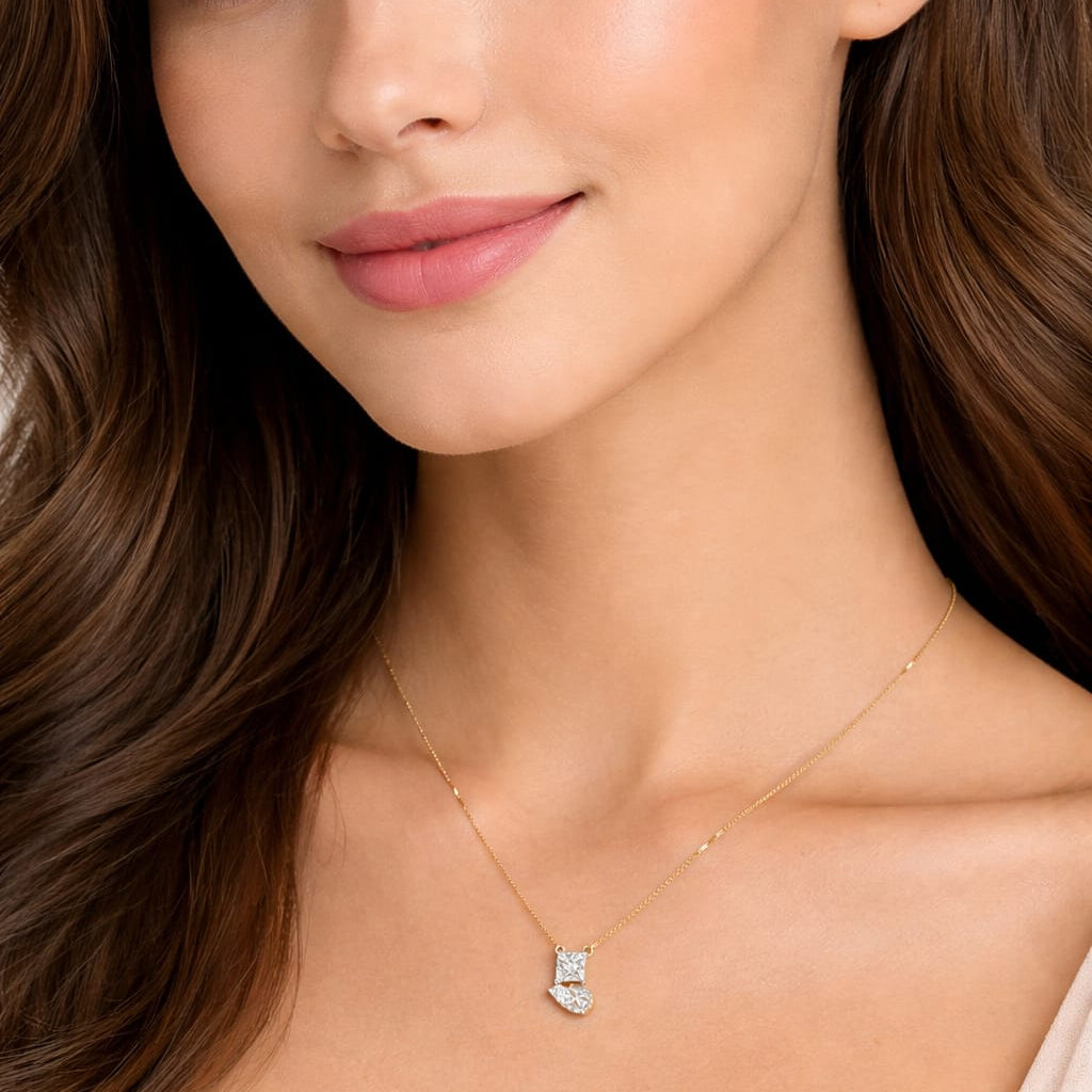 Woman wearing a delicate necklace with a small pendant against a neutral background