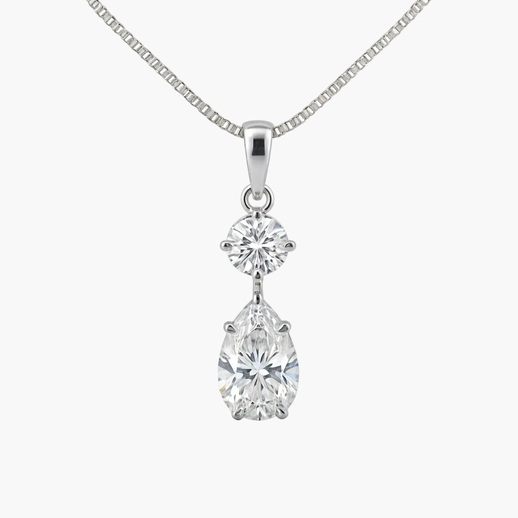 Diamond necklace with two clear gemstones on a white background