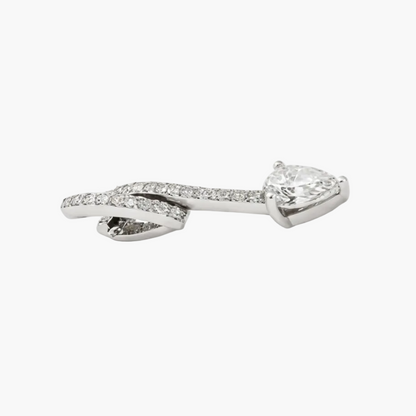 Silver bow-shaped earring with clear gemstones on a white background