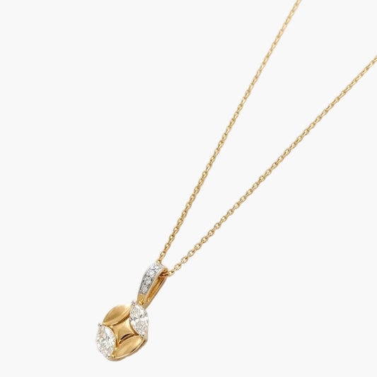 Gold necklace with a heart-shaped pendant on a white background