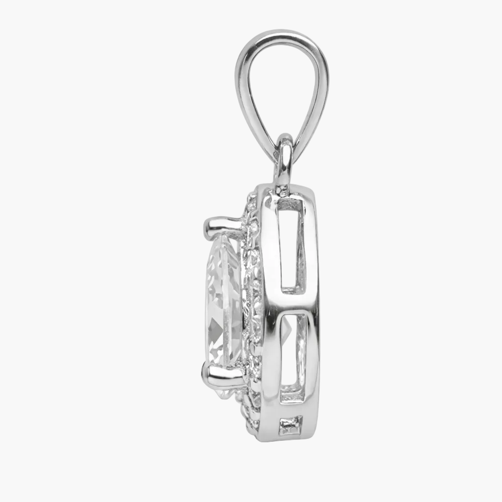 Silver pendant with a clear gemstone on a white background