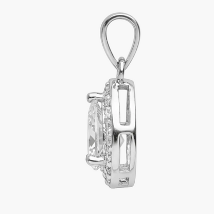 Silver pendant with a clear gemstone on a white background