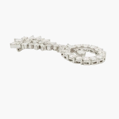 Silver bracelet with clear stones on a white background