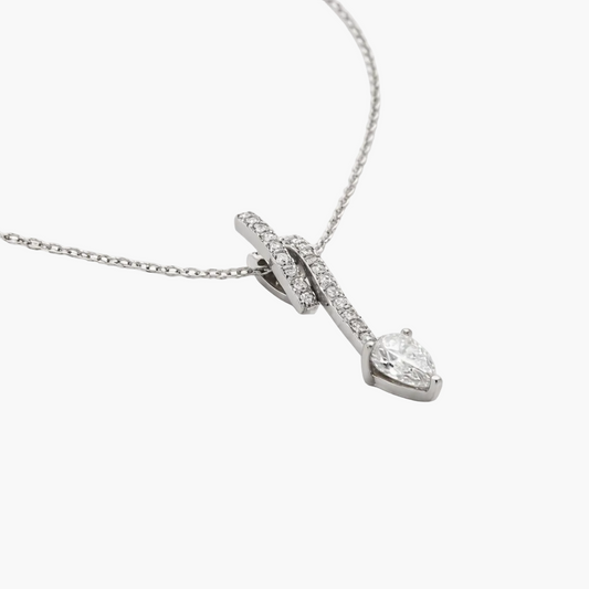 Diamond necklace with a teardrop pendant on a white background