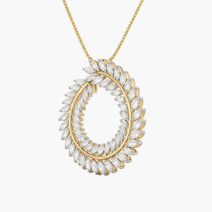 Gold necklace with a circular diamond pendant on a white background