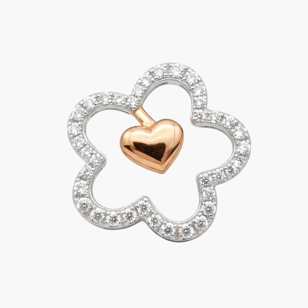 Jewelry pendant with rose gold heart and silver clover design on a white background