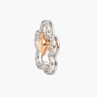 Two-tone ring with heart design on a white background