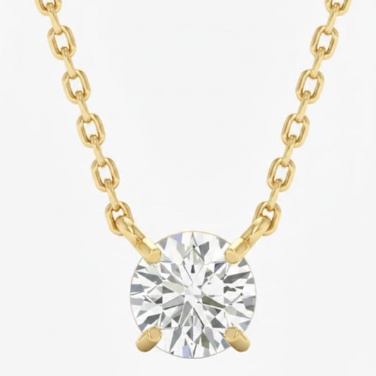 Gold necklace with a round diamond pendant on a white background