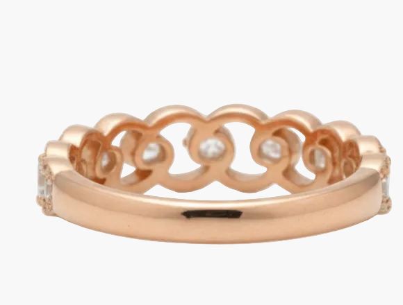 Rose gold ring with diamonds on a white background