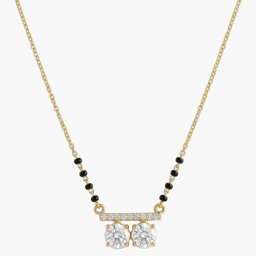 Gold necklace with diamond pendant on a white background