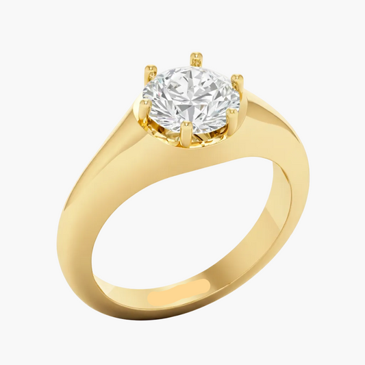 Gold ring with a diamond on a white background