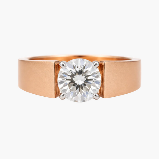 Rose gold ring with a large diamond on a white background
