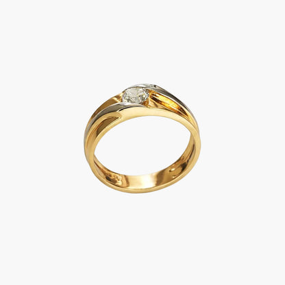 Gold ring with a diamond on a white background