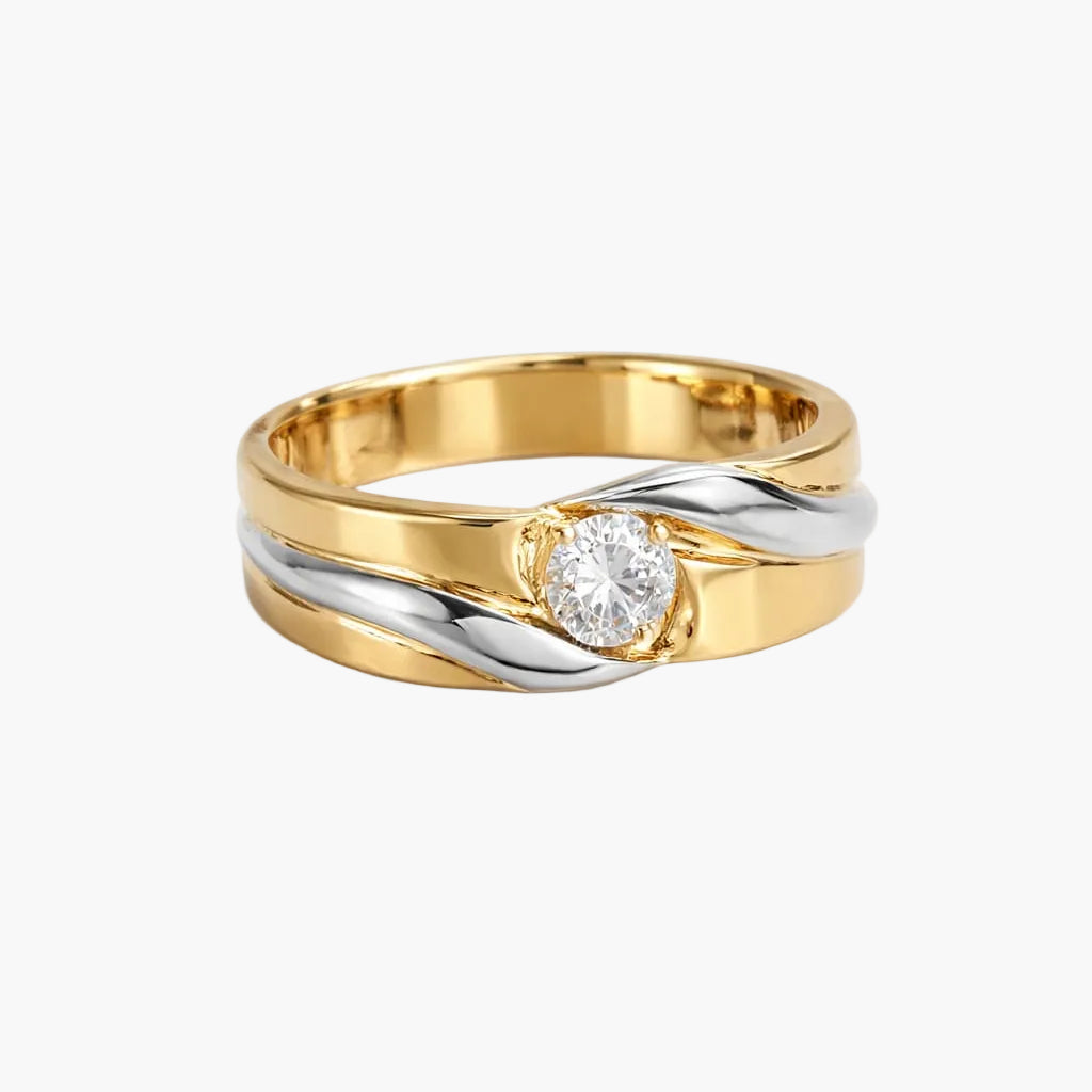 Two-tone gold ring with a diamond on a white background