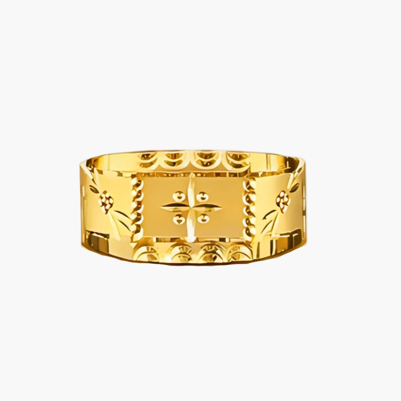 Gold ring with intricate design on a white background