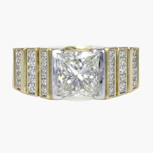 Diamond ring with a central square-cut diamond and smaller diamonds on a gold band against a white background