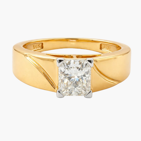 Gold ring with a large diamond on a white background